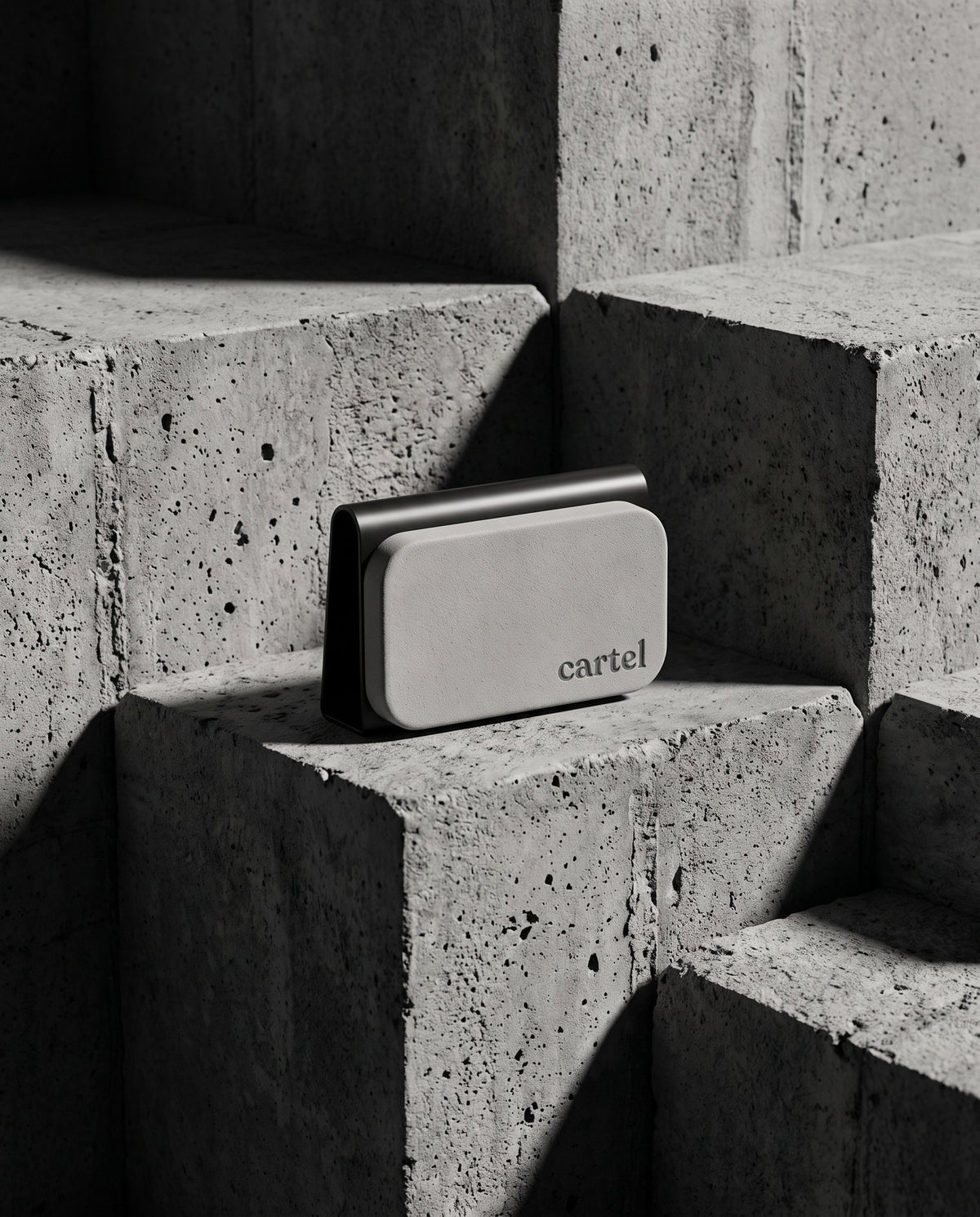 Cartel car perfume in its steel visor clip on concrete