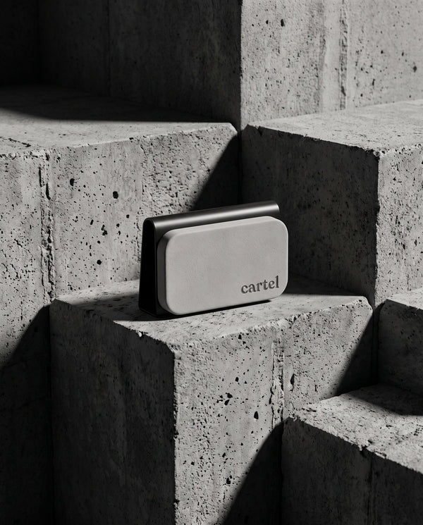 Cartel car perfume in its steel visor clip on concrete